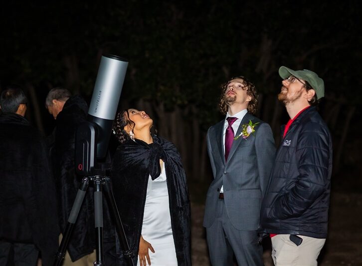 People observing the night sky with a telescope at Lowell Observatory.