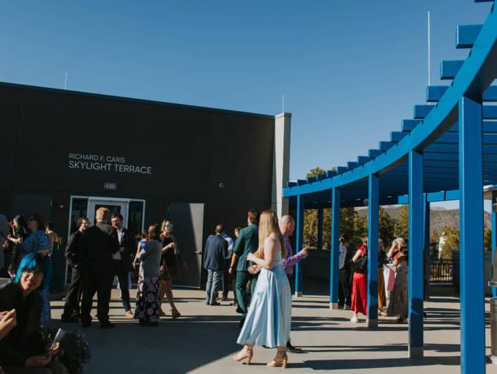 People gather outside Richard F. Caris Skylight Terrace at Lowell Observatory.