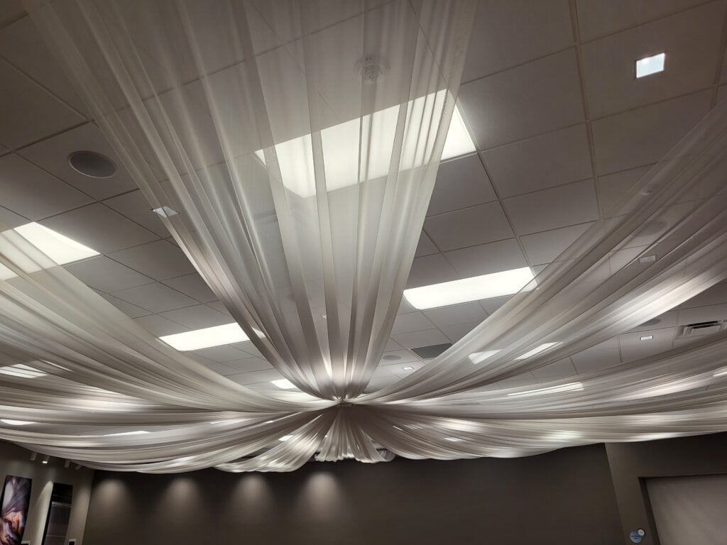 Decorative fabric drapes hanging from the ceiling at Lowell Observatory event.